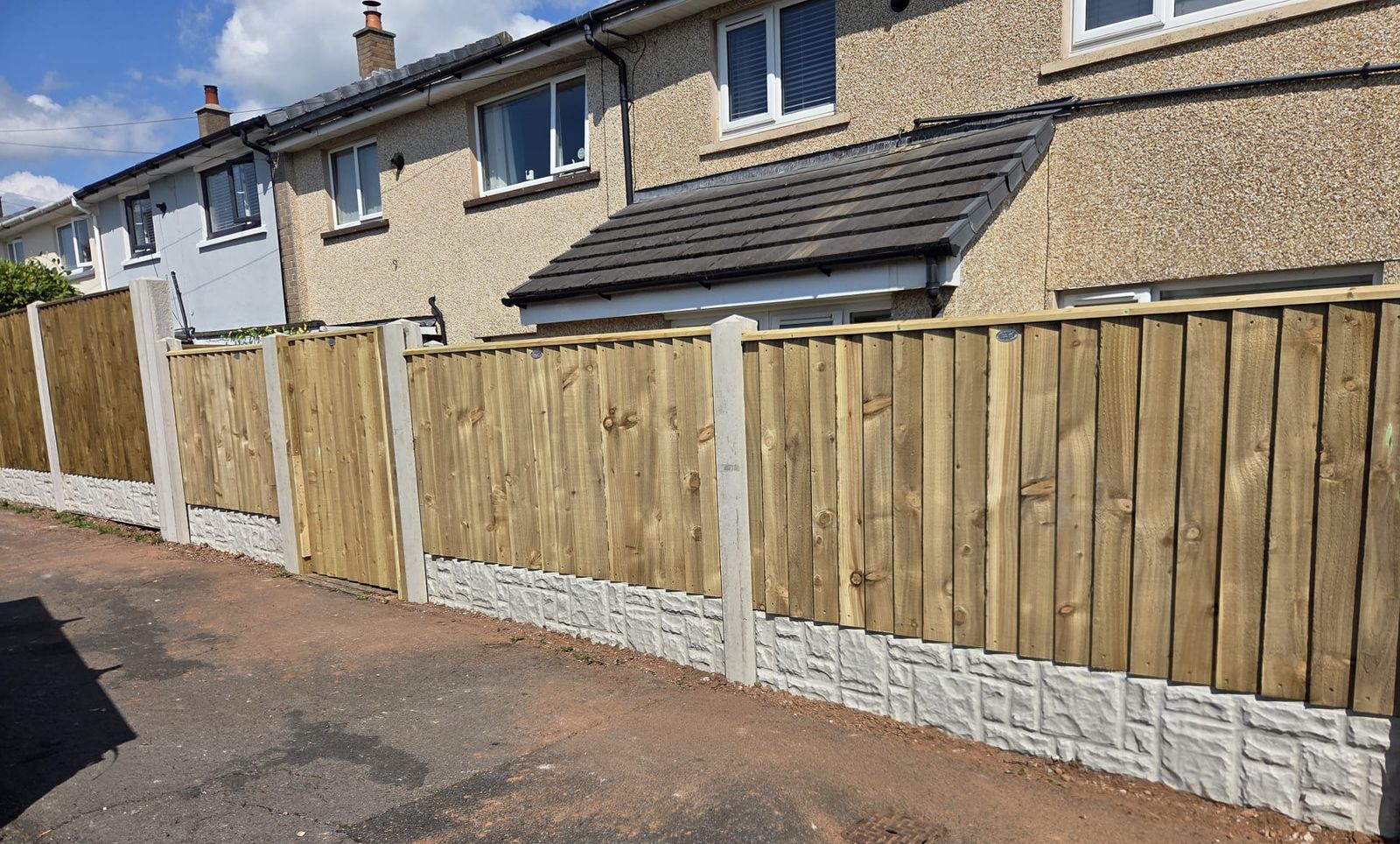 New closeboard fencing with concrete posts and rock-faced gravel boards