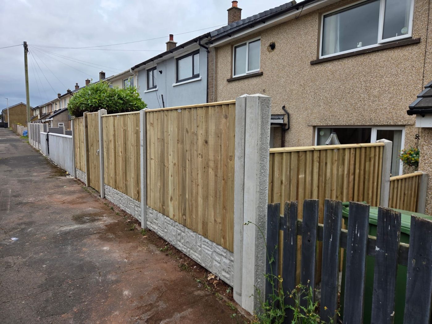 Closeboard fencing on concrete posts
